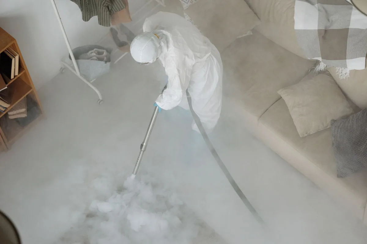 Biohazard cleanup technician in protective equipment, Shields, MI